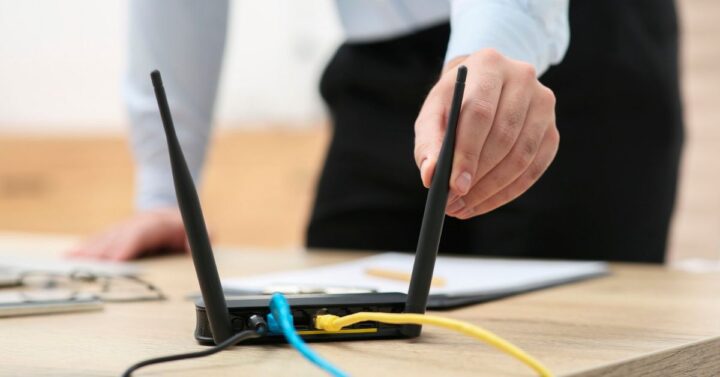 Remote worker troubleshooting Wi-Fi connectivity in a Sydney home office