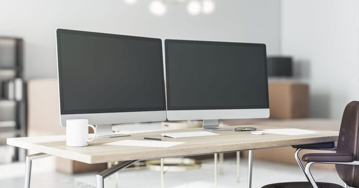 Dual monitor setup with monitor arms